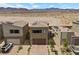 Beautiful aerial view of a home with a paved driveway in a desert community at 9715 Harper Edge St, Las Vegas, NV 89143