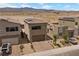 Scenic aerial shot of houses featuring solar panels and paved driveways with desert landscaping at 9715 Harper Edge St, Las Vegas, NV 89143