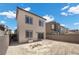 Home exterior with a fenced backyard, sliding glass doors, and ample space for outdoor living at 9715 Harper Edge St, Las Vegas, NV 89143