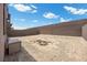 Spacious backyard with a brick fence, pavers, and a blank canvas for landscaping at 9715 Harper Edge St, Las Vegas, NV 89143