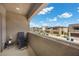 View from the balcony, showcasing neighboring homes under a blue sky at 9715 Harper Edge St, Las Vegas, NV 89143