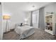 Cozy bedroom with a twin bed, gray curtains, and carpet at 9715 Harper Edge St, Las Vegas, NV 89143