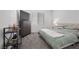 Cozy bedroom with a tufted headboard, soft bedding, and neutral decor at 9715 Harper Edge St, Las Vegas, NV 89143