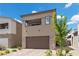 Attractive two-story home boasting a well-manicured lawn, neutral stucco, stone accents, and a two-car garage at 9715 Harper Edge St, Las Vegas, NV 89143