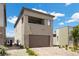 Well maintained two-story home showcasing neutral stucco, brick accents, a two-car garage, and manicured landscaping at 9715 Harper Edge St, Las Vegas, NV 89143