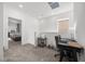 Upstairs landing area, featuring carpet and a desk with a view of the Primary bedroom at 9715 Harper Edge St, Las Vegas, NV 89143