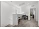 Upstairs landing area with carpet, a desk, and views of the outside at 9715 Harper Edge St, Las Vegas, NV 89143