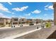 Scenic neighborhood street view showcasing modern homes and manicured landscaping at 9715 Harper Edge St, Las Vegas, NV 89143