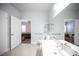 Bathroom featuring a white vanity with a view of bedroom through the door at 10245 S Maryland Pkwy # 106, Las Vegas, NV 89183