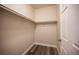 Walk-in closet with wood-look flooring and shelving for ample storage space at 10245 S Maryland Pkwy # 106, Las Vegas, NV 89183