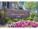 Elegant community signage set against vibrant floral landscaping at 10245 S Maryland Pkwy # 106, Las Vegas, NV 89183