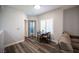 Bright dining area featuring modern lighting, a cozy table setting, and seamless transition to the living space at 10245 S Maryland Pkwy # 106, Las Vegas, NV 89183