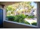 View of landscaped grounds from a private balcony, providing serene outdoor living at 10245 S Maryland Pkwy # 106, Las Vegas, NV 89183