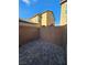 Outdoor patio featuring interlocking pavers and a block wall for a private outdoor space at 1050 Spotted Saddle St, Henderson, NV 89015