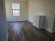 Serene bedroom offering modern wood-style flooring, enhancing the room's appeal at 1050 Spotted Saddle St, Henderson, NV 89015