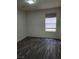 Cozy bedroom provides a comfortable space with modern wood-style flooring at 1050 Spotted Saddle St, Henderson, NV 89015