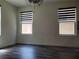 Bright bedroom with a ceiling fan and hard surface floors at 1050 Spotted Saddle St, Henderson, NV 89015