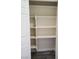 A clean, white closet presents an organized storage solution with built-in shelving at 1050 Spotted Saddle St, Henderson, NV 89015