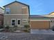 Charming two-story home featuring a two-car garage and a well-maintained front yard at 1050 Spotted Saddle St, Henderson, NV 89015