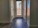 Entrance hallway featuring contemporary design with wood-style flooring and natural light at 1050 Spotted Saddle St, Henderson, NV 89015