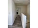 Hallway features contemporary design with wood-style flooring, seamlessly connecting various rooms at 1050 Spotted Saddle St, Henderson, NV 89015
