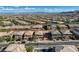 Expansive aerial view of a neighborhood, showcasing rooftops and community layout at 10693 Harvest Green Way, Las Vegas, NV 89135