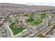 Expansive community park with sports fields, play areas, and walking paths amidst a residential neighborhood at 10693 Harvest Green Way, Las Vegas, NV 89135