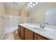 Bright bathroom featuring vanity with lots of counter space, tub-shower, and tiled flooring at 10693 Harvest Green Way, Las Vegas, NV 89135
