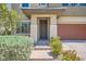 Inviting front entrance with brick steps, desert landscaping, and a covered porch at 10693 Harvest Green Way, Las Vegas, NV 89135