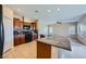 Updated kitchen has granite countertops, tile backsplash, and stainless appliances at 10693 Harvest Green Way, Las Vegas, NV 89135