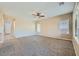Spacious living room with carpet and natural light at 10693 Harvest Green Way, Las Vegas, NV 89135