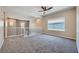 Upstairs loft with neutral colored walls, carpeted floors, lots of light, and ceiling fan at 10693 Harvest Green Way, Las Vegas, NV 89135