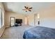 Spacious main bedroom features neutral colors, a ceiling fan, and carpeted floors at 10693 Harvest Green Way, Las Vegas, NV 89135
