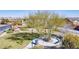 A shaded park area with benches and walking paths creates a welcoming place to relax at 10693 Harvest Green Way, Las Vegas, NV 89135