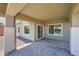 Covered patio space with stone flooring, perfect for outdoor entertaining at 10693 Harvest Green Way, Las Vegas, NV 89135