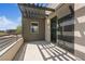 Balcony area with metal railings, pergola covering, and sliding glass door access at 10895 Artesano Ave, Las Vegas, NV 89135