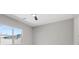 A bedroom with a large window providing natural light at 10895 Artesano Ave, Las Vegas, NV 89135