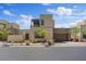 Modern two-story home featuring neutral tones, desert landscaping, and a pergola covered balcony at 10895 Artesano Ave, Las Vegas, NV 89135