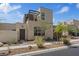 Contemporary home boasting stone accents, desert landscaping, and a pergola covered balcony at 10895 Artesano Ave, Las Vegas, NV 89135