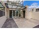 Private patio featuring brick flooring, stone accents, and access to the interior through sliding glass doors at 10895 Artesano Ave, Las Vegas, NV 89135