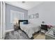 A well-lit bedroom with blue walls, shuttered windows, and a comfortable bed and stylish decor at 11 Feather Sound Dr, Henderson, NV 89052