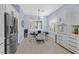 Bright breakfast nook featuring stainless steel appliances, white cabinetry, and shutters at 11 Feather Sound Dr, Henderson, NV 89052