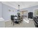 Bright dining area featuring modern lighting, hardwood floors, and ample seating at 11 Feather Sound Dr, Henderson, NV 89052