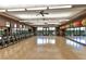 Large fitness center with several exercise bikes, wall mirrors, and ample natural light at 11 Feather Sound Dr, Henderson, NV 89052