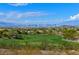 Expansive golf course view with city skyline and mountain backdrop at 11 Feather Sound Dr, Henderson, NV 89052