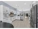 Bright kitchen features white cabinets, stainless steel appliances, and an adjacent dining area at 11 Feather Sound Dr, Henderson, NV 89052