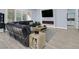 Spacious living room with modern fireplace, hardwood floors, and comfortable seating at 11 Feather Sound Dr, Henderson, NV 89052