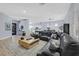 Open living space with modern fireplace, hardwood floors, and comfortable seating at 11 Feather Sound Dr, Henderson, NV 89052