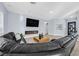 Modern living room with sleek fireplace, hardwood floors, and comfortable seating at 11 Feather Sound Dr, Henderson, NV 89052