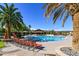 Relax by this beautiful pool with several seating options and gorgeous desert landscaping at 11 Feather Sound Dr, Henderson, NV 89052